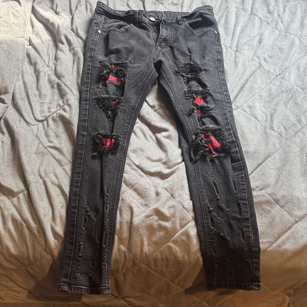 Distressed Black Jeans with Red Accents
